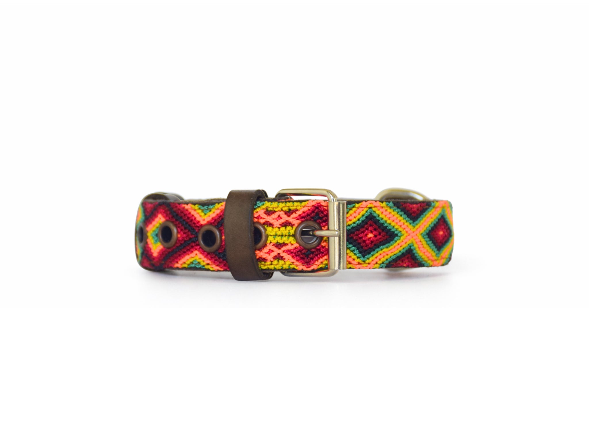 A woven dog collar featuring a vibrant geometric pattern in red, yellow, green, and black, with a brown leather keeper and a silver-tone metal buckle, shown against a plain white background.